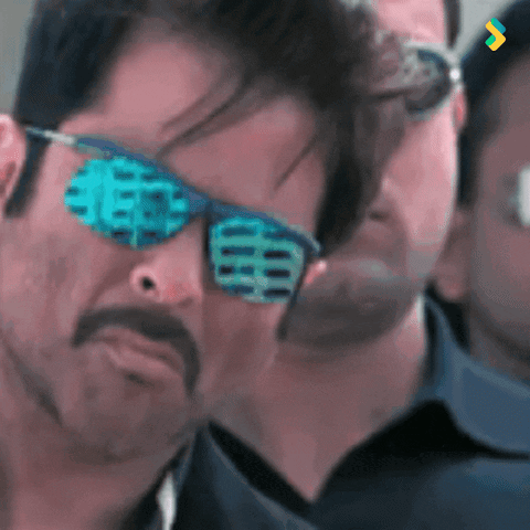 A Man Wearing Sunglasses With A Chinese Symbol On The Lens GIF