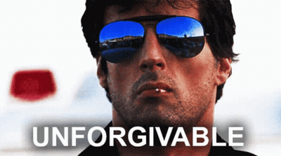A Man Wearing Sunglasses With The Word Unforgivable Written Below Him GIF