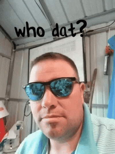 A Man Wearing Sunglasses With The Words Who Dat Written Above Him GIF
