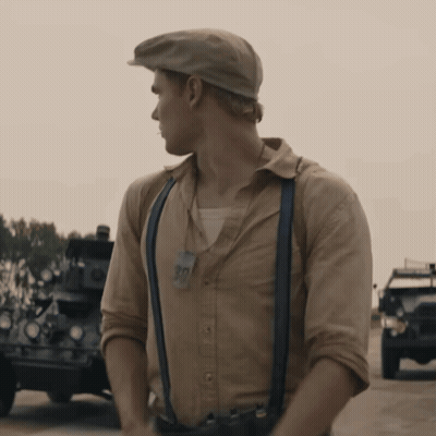 A Man Wearing Suspenders And A Hat With A Tag That Says 90 GIF
