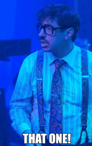 A Man Wearing Suspenders And A Tie Says " That One " GIF