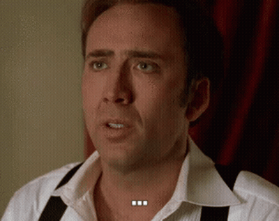 A Man Wearing Suspenders And A White Shirt Is Making A Funny Face . GIF