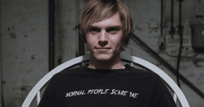 A Man Wears A Black Shirt That Says Normal People Scare Me GIF