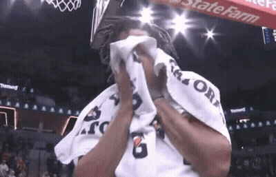 A Man Wipes His Face With A Gatorade Towel GIF