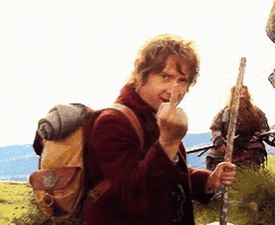 A Man With A Backpack Is Making A Middle Finger Gesture GIF