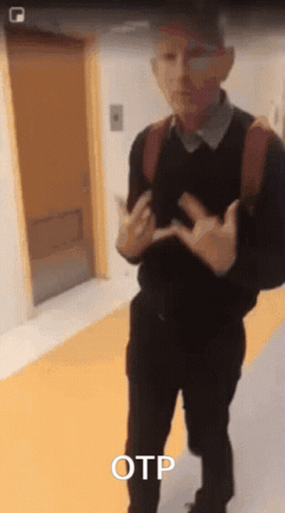 A Man With A Backpack Is Standing In A Hallway With The Word Otp Above Him GIF