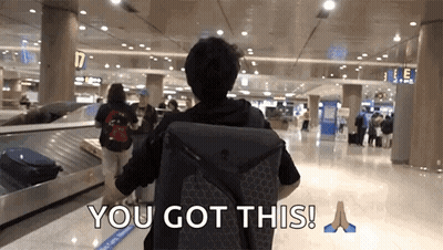 A Man With A Backpack Walking Through An Airport With The Words " You Got This " On The Bottom GIF