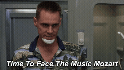 A Man With A Bandage On His Face And The Words Time To Face The Music Mozart Behind Him GIF