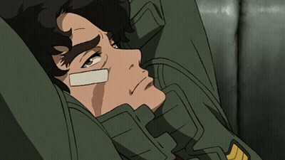 A Man With A Bandage On His Face Laying Down GIF