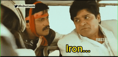 A Man With A Bandage On His Head Is Sitting Next To Another Man With The Word Iron In Yellow Letters GIF