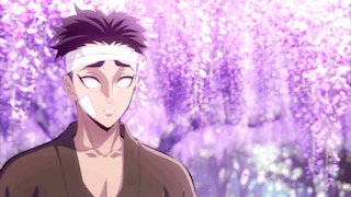 A Man With A Bandage On His Head Is Standing In Front Of A Purple Flowering Tree . GIF
