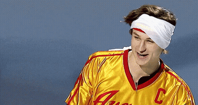 A Man With A Bandage On His Head Wears A Yellow Jersey With The Letter C On The Front GIF