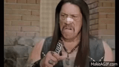 A Man With A Bandage On His Nose Is Holding A Snickers Bar In His Hand . GIF