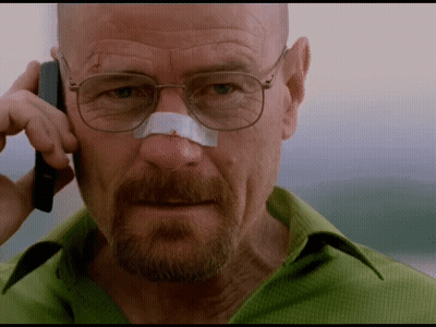 A Man With A Bandage On His Nose Is Talking On A Cell Phone GIF