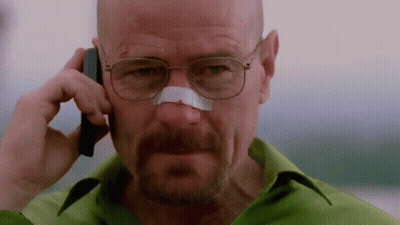A Man With A Bandage On His Nose Is Talking On A Cell Phone GIF
