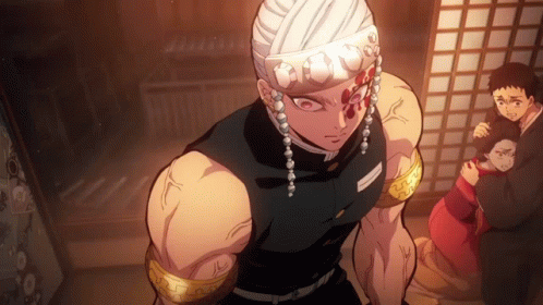 A Man With A Bandaged Head Is Standing In A Dark Room GIF