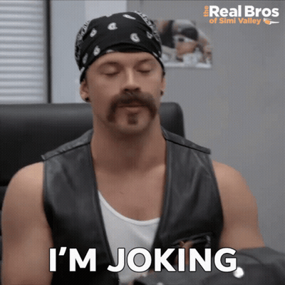 A Man With A Bandana On His Head And A Mustache Says I 'M Joking GIF