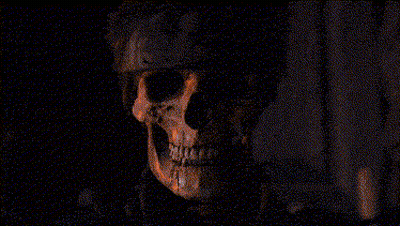 A Man With A Bandana On His Head Is Looking At The Camera In A Pixelated Image . GIF