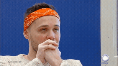 A Man With A Bandana On His Head Is On A Record Show GIF