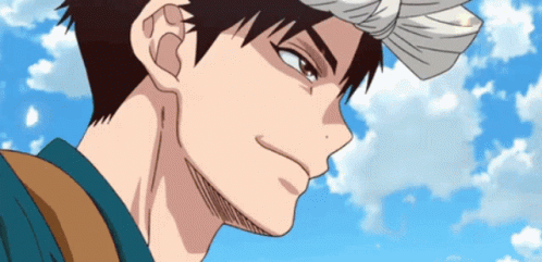 A Man With A Bandana On His Head Looks At The Camera GIF