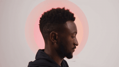 A Man With A Beard And A Black Hoodie Has A Red Circle In The Background GIF