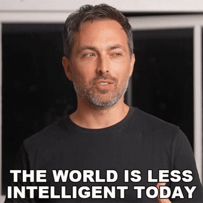 A Man With A Beard And A Black Shirt Says The World Is Less Intelligent Today GIF