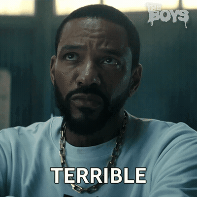 a man with a beard and a chain around his neck says terrible