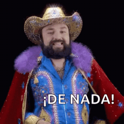 A Man With A Beard And A Cowboy Hat Is Wearing A Blue Jacket And A Purple Feather Boa . GIF