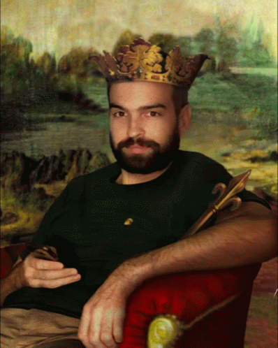 A Man With A Beard And A Crown On His Head GIF