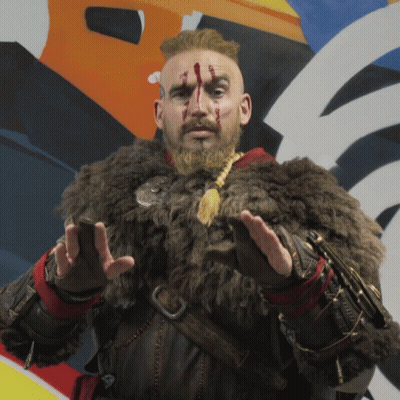 A Man With A Beard And A Fur Coat Has Blood On His Face GIF
