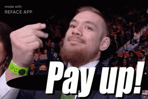 A Man With A Beard And A Green Wristband Says Pay Up ! GIF