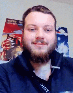 A Man With A Beard And A Lanyard That Says District GIF
