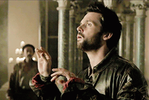A Man With A Beard And A Leather Jacket Is Looking Up GIF