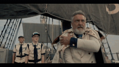 A Man With A Beard And A Name Tag That Says " Captain " On It GIF