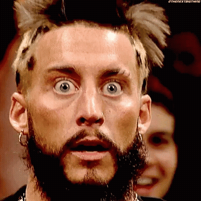 A Man With A Beard And A Nose Ring Is Making A Funny Face . GIF