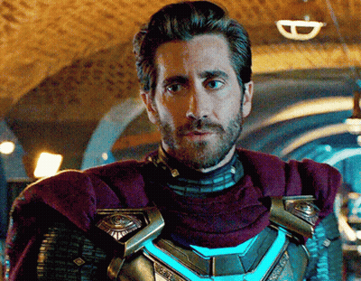 A Man With A Beard And A Purple Cape Is Standing In A Dark Room GIF