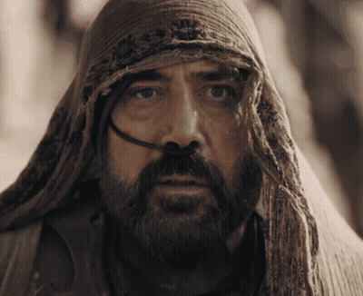 A Man With A Beard And A Scarf Around His Head Has A Hose Coming Out Of His Nose GIF