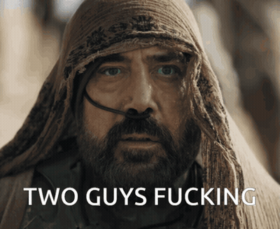 A Man With A Beard And A Scarf Around His Head Has The Words Two Guys Fucking On His Face GIF