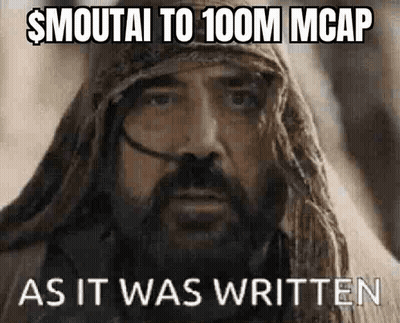 A Man With A Beard And A Scarf Around His Head Is Making A Funny Face While Wearing A Turban . GIF