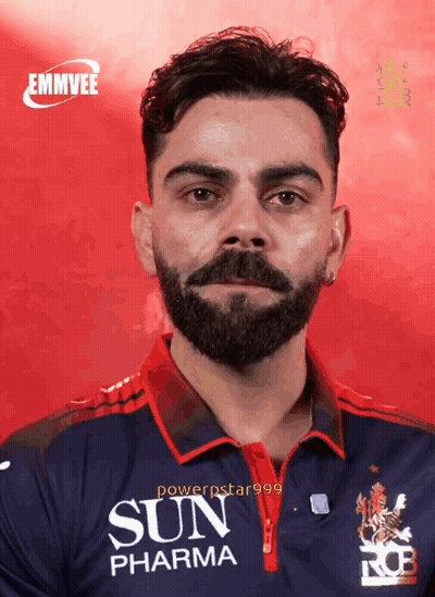 A Man With A Beard And A Sun Pharma Shirt GIF
