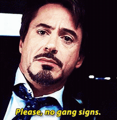 A Man With A Beard And A Tie Says Please No Gang Signs GIF