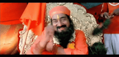 A Man With A Beard And A Turban Is Sitting On A Throne GIF