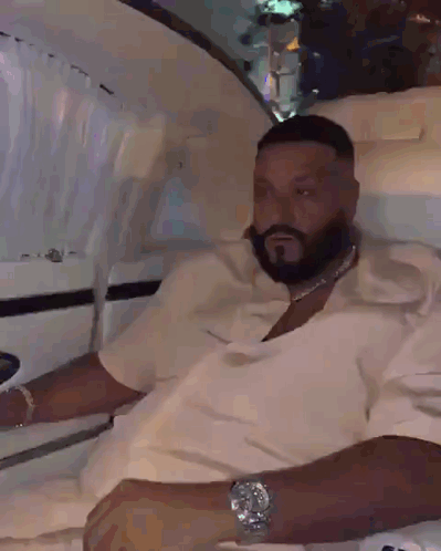 A Man With A Beard And A Watch Is Sitting In A Car GIF