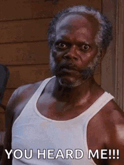 A Man With A Beard And A White Tank Top Is Saying `` You Heard Me ! '' GIF