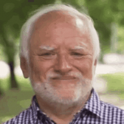 A Man With A Beard And Bald Head Is Smiling . GIF