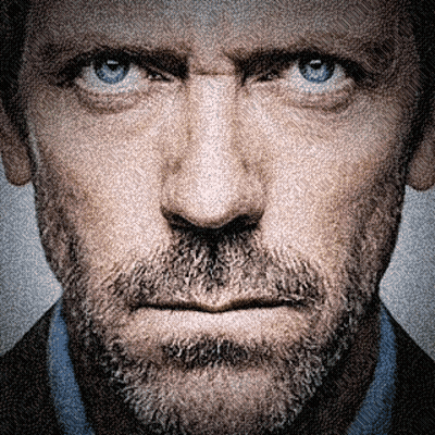 A Man With A Beard And Blue Eyes Looks At The Camera GIF