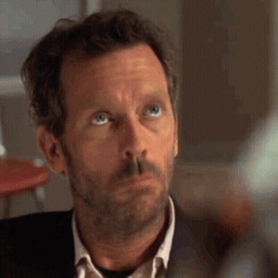 A Man With A Beard And Blue Eyes Looks Up At Something GIF