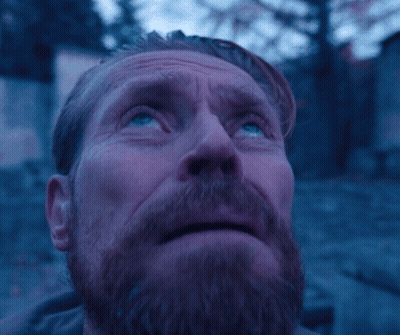 A Man With A Beard And Blue Eyes Looks Up At The Sky GIF