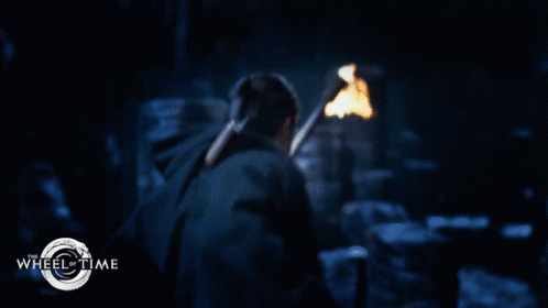 A Man With A Beard And Curly Hair Is In A Wheel Of Time Poster GIF