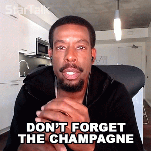 A Man With A Beard And Ear Buds Says " Do N't Forget The Champagne " GIF
